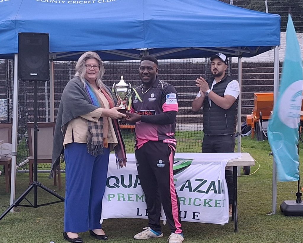 Cosmond Walter Captain of Whiterose Cricket Club Collecting winner Trophy from Sue Pascoe from Yorkshire Cricket Foundation